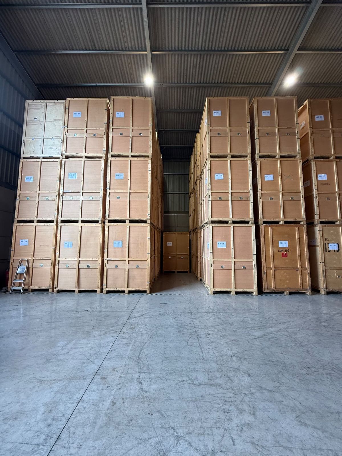 Rows of wooden storage containers stacked in the RH warehouse