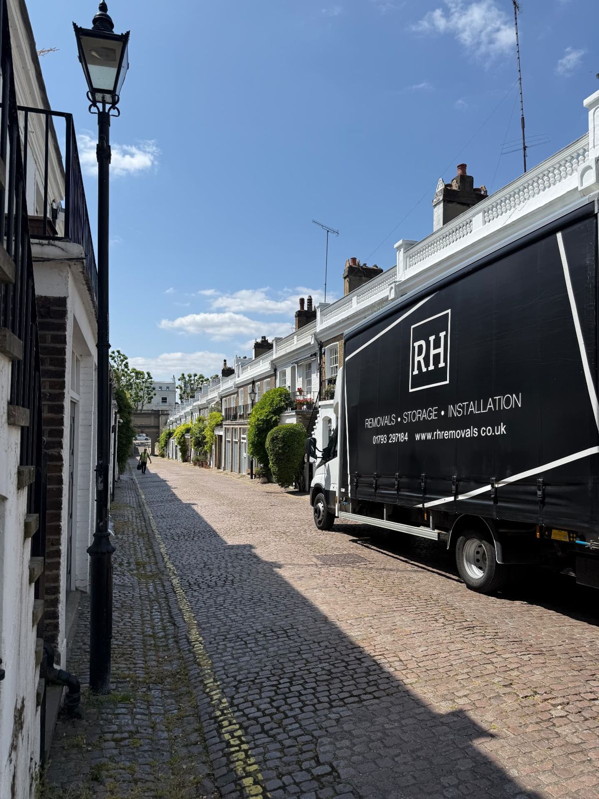 RH Removals lorry on a cobbled London mews