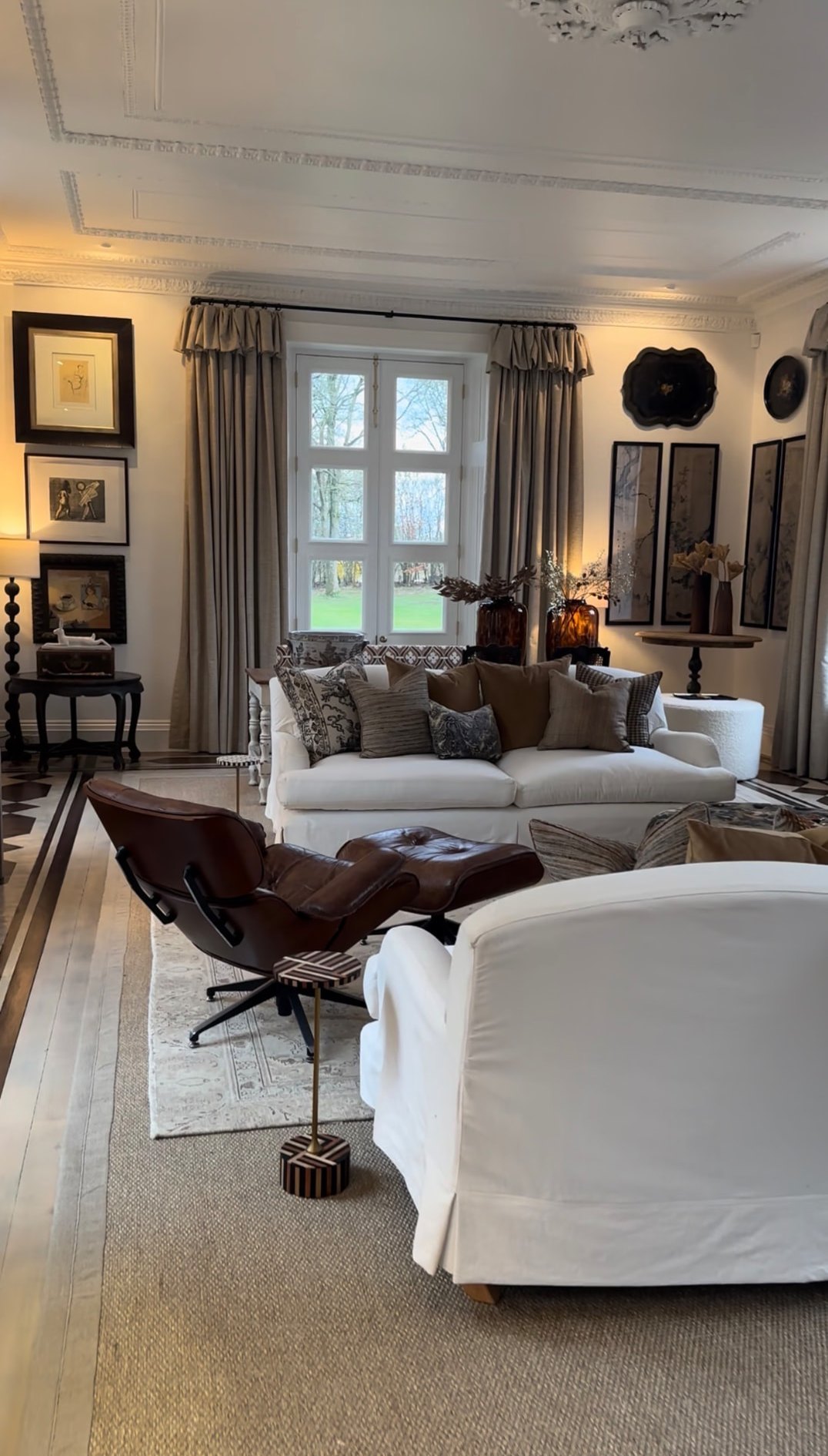The same drawing room finished with artwork, cushions, curtains and lamps