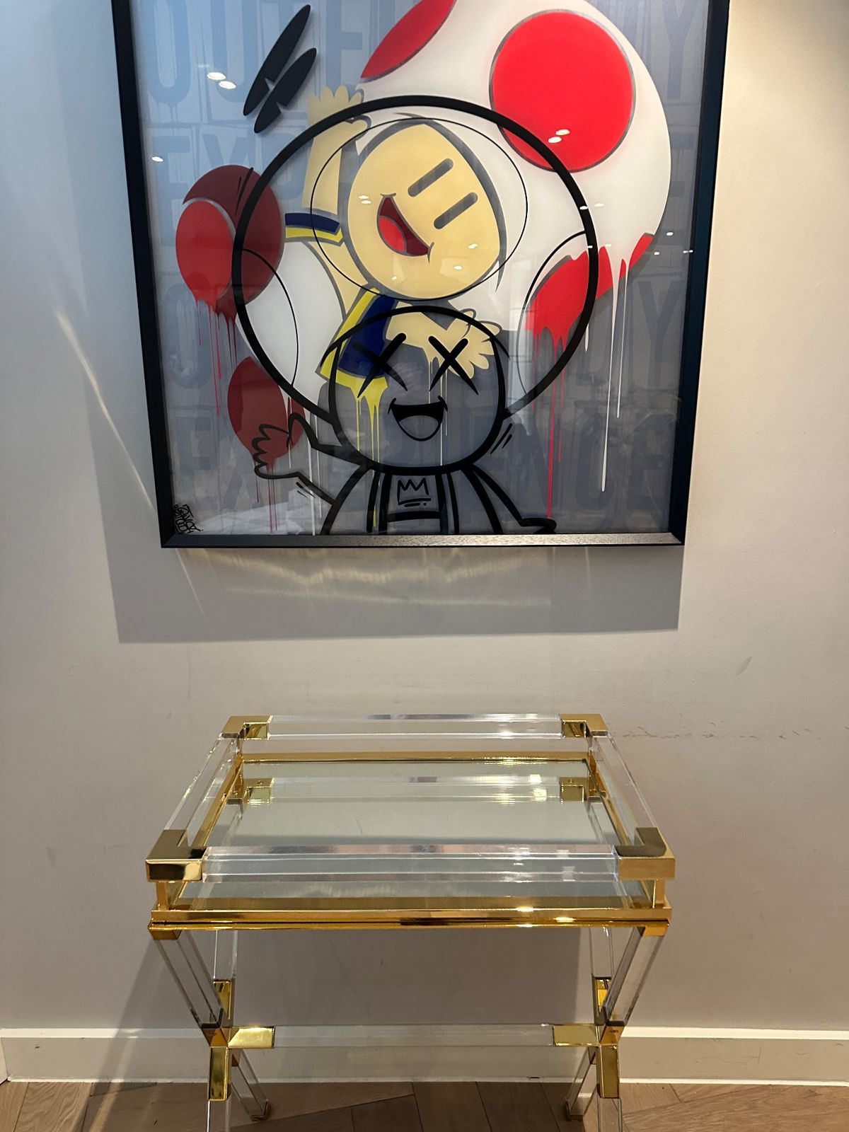 The same artwork and console table unwrapped and in place after the move