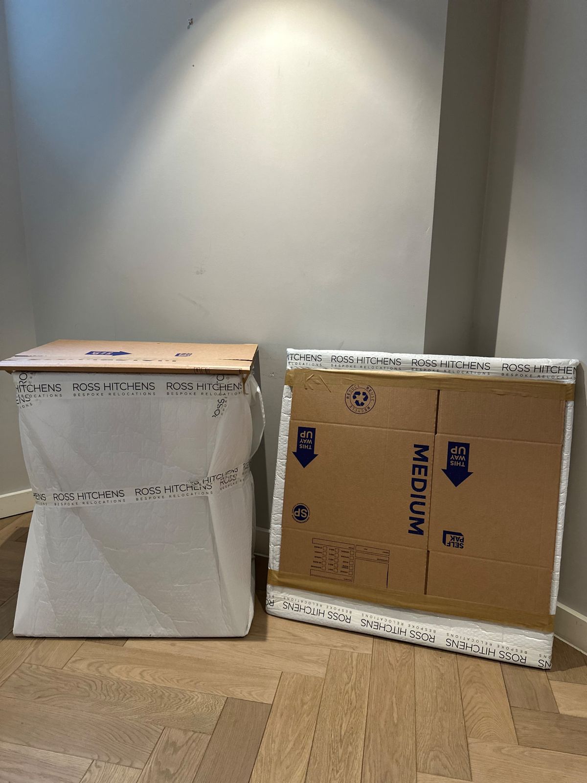 Artwork and a console table wrapped and protected by RH before the move