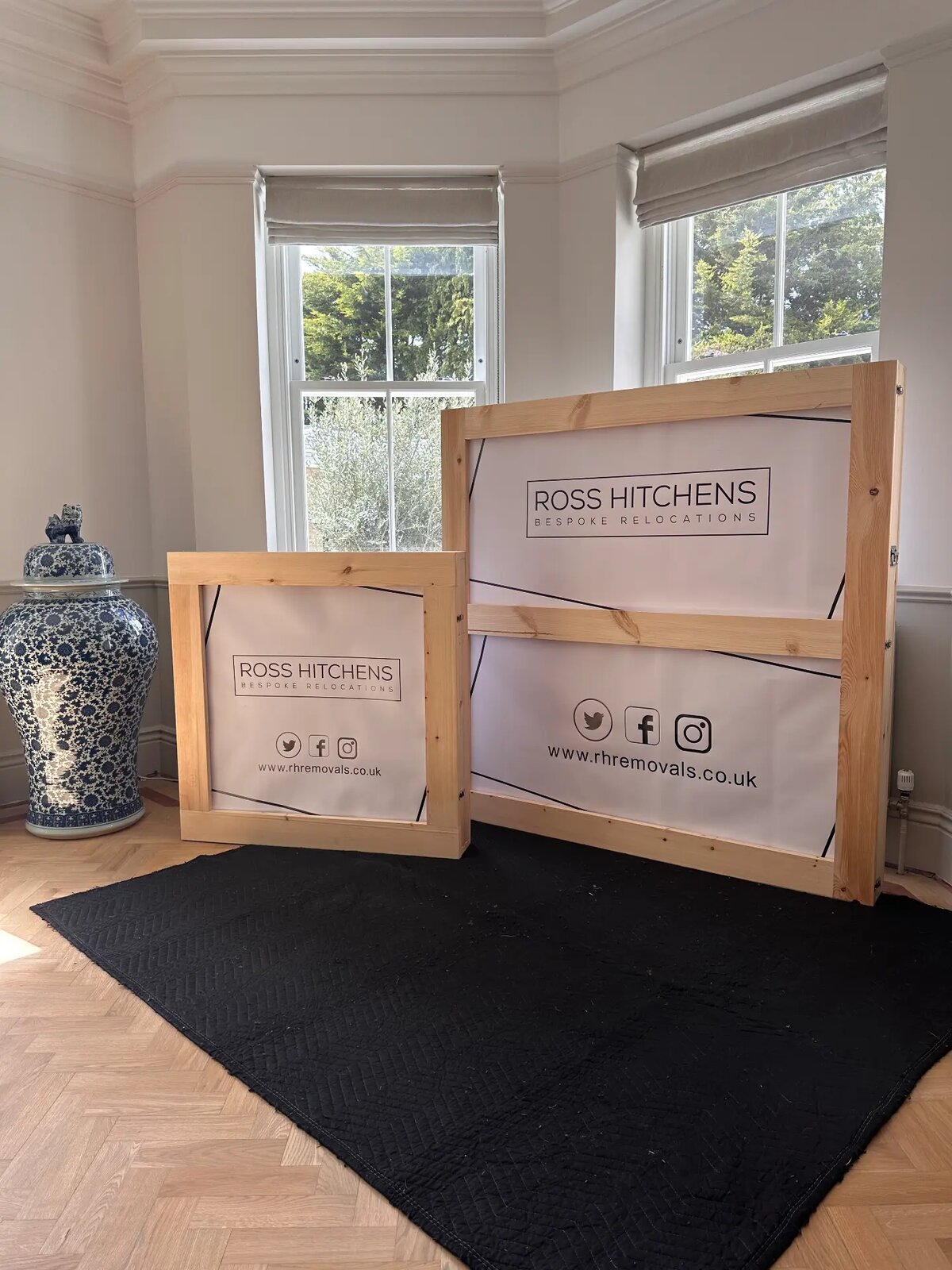 Bespoke RH crates ready in a room with sash windows